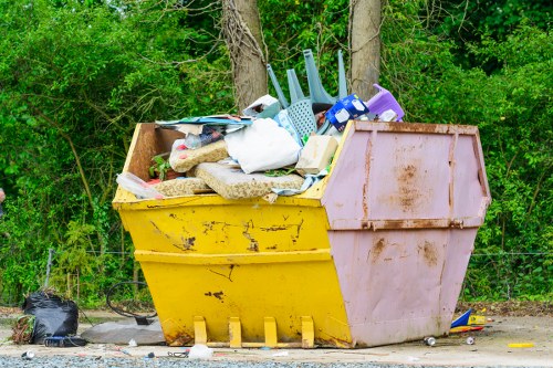 Office waste bins and commercial refuse collection vehicle at a business site