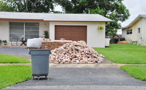 Waste clearance truck transporting debris from a construction site